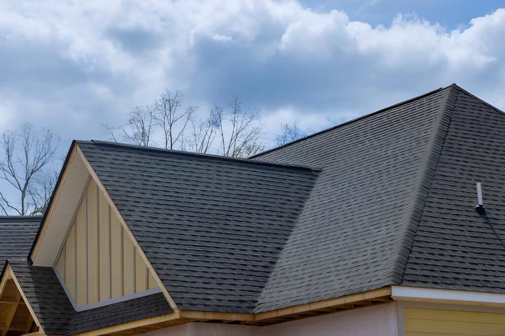 Newly installed shingle roof on modern residential home